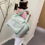 Mode léger sac de voyage sport yoga fitness sac nouveau pliage sec et humide séparation grande capacité sac d'expansion