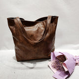 Mode rétro européenne et américaine Rivet contraste couleur couture une épaule Portable fourre-tout femme grande capacité sac