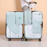 Trousse de toilette pliante de huit pièces ensemble de sac de rangement de voyage sac de rangement de vêtements sac de voyage