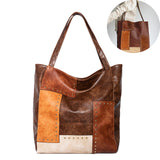 Mode rétro européenne et américaine Rivet contraste couleur couture une épaule Portable fourre-tout femme grande capacité sac